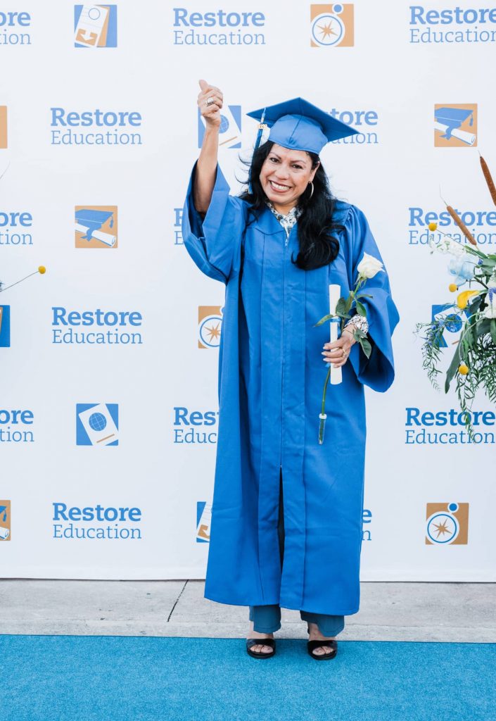 Graduate Giving Thumbs Up